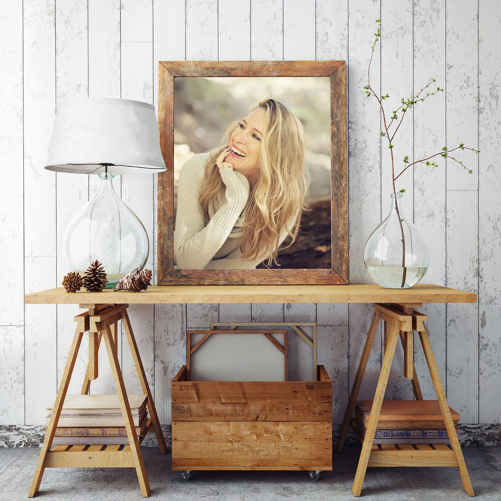 Woman's smiling lifestyle portrait in a wooden frame.