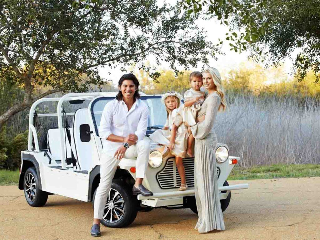Luxurious outdoor family portrait session with fancy car